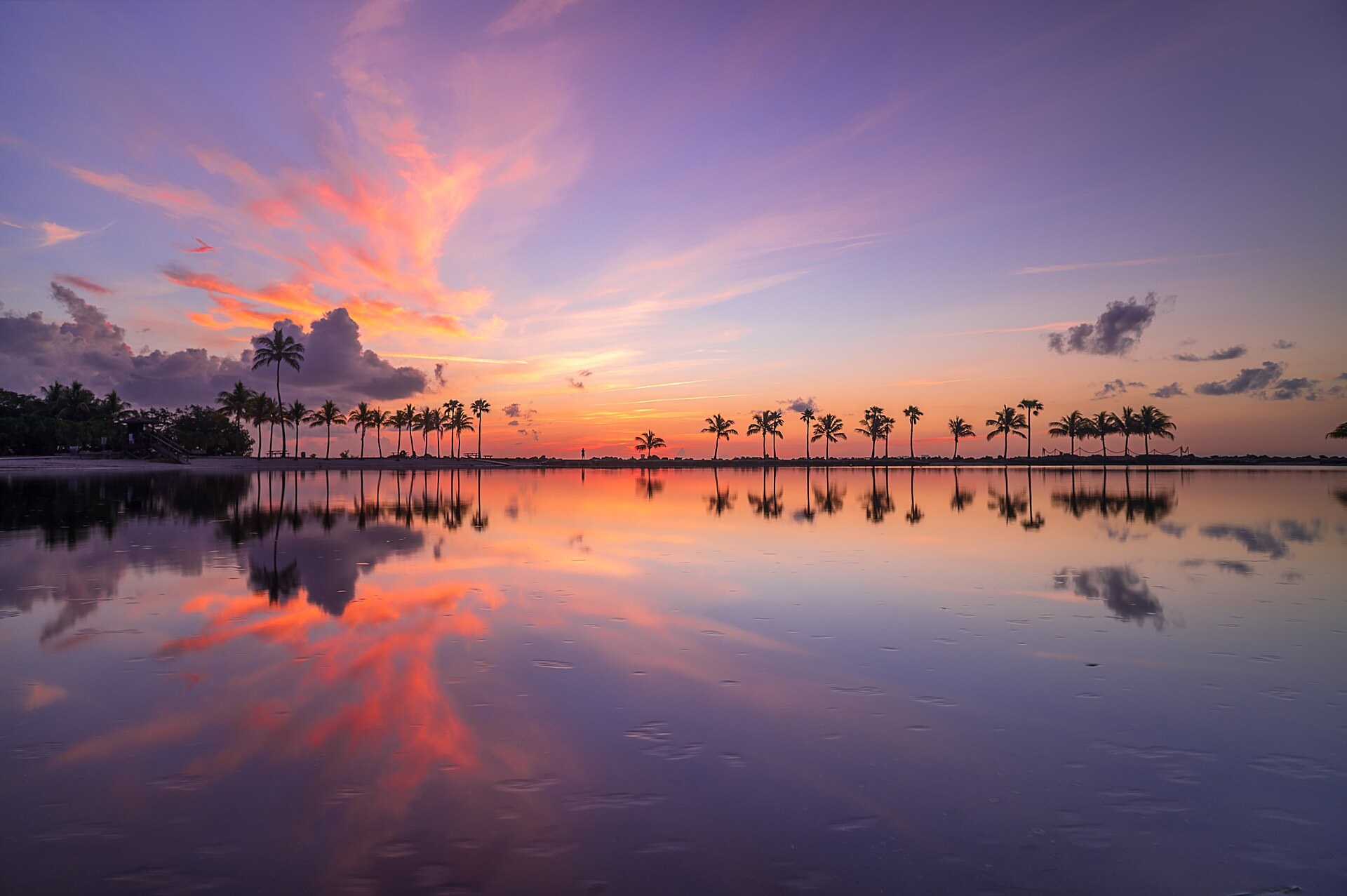 Sunrise at Matheson Hammock Park. Taken from Round Beach, with the distant Miami skyline faintly visible in the background. (Matheson Hammock Park)